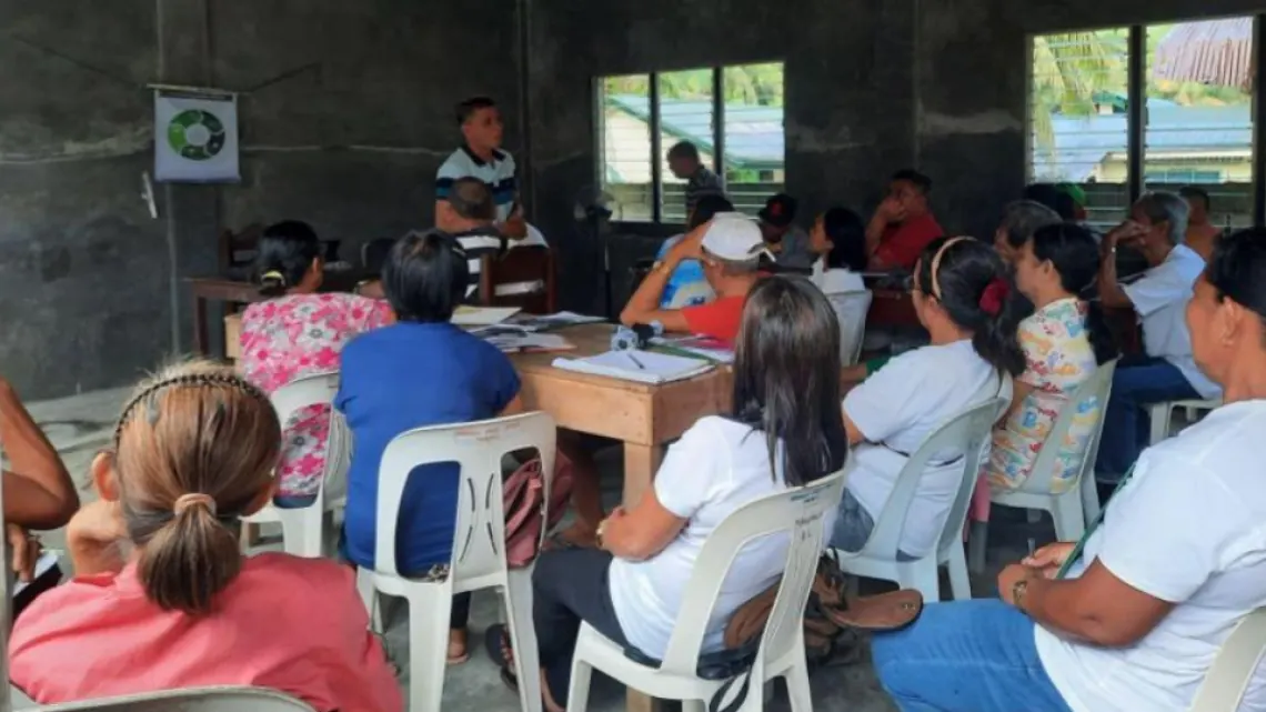 Cooperative members attending a community training session